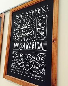 two framed chalkboards on the wall displaying different types of coffees and beverages,