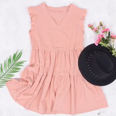 The EMES SHOP dress is detailed with gorgeous ruffle sleeves. Features a v neck line. shift dress silhouette. tiers. and an above knee length. Pair it with a hat and espadrilles for a refreshing summer look.MATERIAL:100% Soft Cotton MEASUREMENTS:Dress Length is 35-37"in Small | Bust & Waist: 37"-39"in Medium | Bust& Waist: 39"-41"in Large | Bust& Waist: 41"-43in V-neck Tiered Dress With Ruffle Hem For Vacation, Feminine V-neck Tiered Summer Dress, V-neck Tiered Dress With Ruffle Hem For Day Out, V-neck Tiered Dress With Ruffle Hem For Beach, Summer Tiered Short Sleeve Dress With Ruffle Hem, Summer Tiered Dress With Ruffle Hem And Short Sleeves, Casual V-neck Tiered Dress For Beach, Spring Pink V-neck Tiered Dress, Short Sleeve Tiered Ruffle Dress For Summer