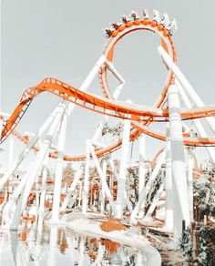 the roller coaster is being displayed in an amusement park