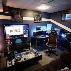 a living room filled with lots of computer monitors