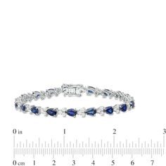 With elegant design, this beautiful fashion bracelet is a shimmering classic that will complement her wardrobe for years to come. Crafted in sterling silver, this lovely look features 6.0 x 4.0mm pear-shaped lab-created bright blue sapphires alternating with trios of 2.0mm lab-created white sapphires. Buffed to a brilliant luster, this 7.0-inch bracelet secures with a tongue and groove clasp. Classic Sapphire Bracelets For Anniversary, Elegant Blue Sterling Silver Bracelet For Formal Occasions, Blue Diamond Bracelet For Formal Occasions, Sapphire Tennis Bracelet For Formal Occasions, Elegant Blue Bracelets For Anniversary, Elegant Sapphire Sterling Silver Bracelet As Gift, Classic Blue Bracelets, Elegant Sterling Silver Bracelet With Sapphire, Elegant Blue Sterling Silver Bracelet With Gemstone