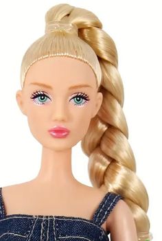 a barbie doll with blonde hair wearing a blue dress and pink lipstick on her lips