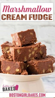 chocolate marshmallow cream fudge is stacked on top of each other in a white bowl