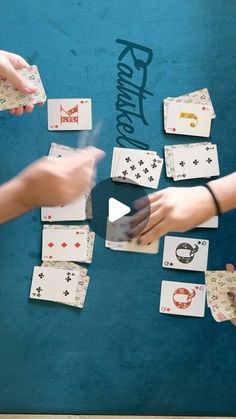 several people are playing cards on a blue surface with the words raviancee written above them