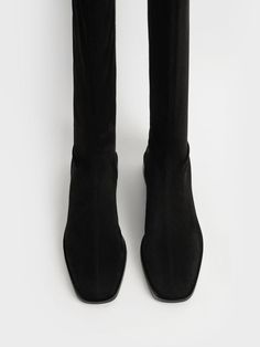 Strut your stuff in these boots. The knee-high length and square toe design will make sure you look sophisticated and chic, whilst the black faux suede offers a smooth and classy finish. Set on a low 2.5cm flat heel, long days will feel a little bit shorter when you have these boots on. We recommend matching them with a floral dress and a double handle tote bag for a graceful look. Knee High Flat Boots, High Flat Boots, Black Flat Boots, Knee High Boots Flat, Look Sophisticated, Toes Designs, Charles Keith, Black Textures, Flat Boots