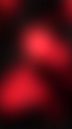 a blurry image of red and black colors