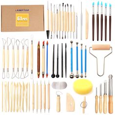 an assortment of kitchen utensils and tools displayed in front of a cardboard box