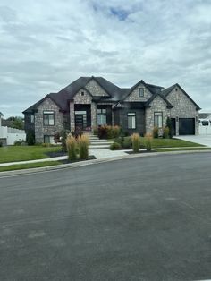 a large house sitting on the side of a road