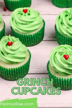 cupcakes with green frosting and red hearts on them