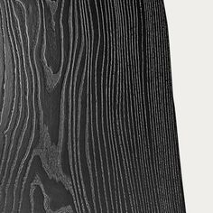 a black and white photo of wood grain