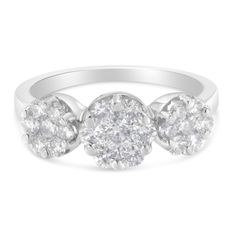 Elegant and timeless, this 14K yellow or white gold diamond cocktail ring features 1.25 carat total weight of diamonds with 21 individual stones. The fashion ring features three round, floral clusters side by side with seven diamonds each in shared prong setting. The two outside clusters are slightly smaller than the central cluster. The ring has a straight, flat-style band with a shiny polished finish. This classic, bold modern statement ring makes a great gift for any special occasion and can Cluster Diamond Ring, Floral Engagement Ring, Engagement Style, Diamond Cocktail Rings, Engagement Ring Sizes, Three Stone Engagement, Three Stone Engagement Rings, White Gold Band, Fashion Ring