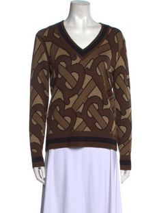 Burberry Wool PulloverBrownPrintedTB MonogramLong Sleeve with V-NeckDesigner Fit: Sweaters by Burberry typically fit true to size. Burberry Clothing, Burberry Top, Burberry Monogram, Burberry Sweater, Burberry Outfit, Jacquard Sweater, Merino Wool Sweater, Brown Sweater, Printed Sweater