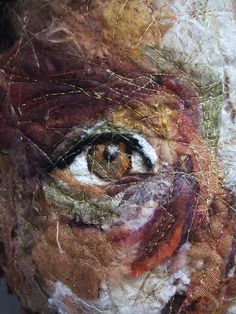 an image of a woman's face covered in fabric