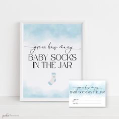 a baby socks in the jar printable is displayed next to a card and envelope