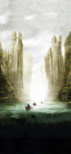 two large statues in the middle of a body of water