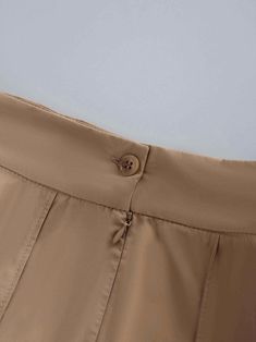 This Cotton Pleated Skirt-Tan is a must. The classic pleated design adds a touch of sophistication, making it perfect for both casual and formal occasions. Formal Summer Bottoms With Pleated Waist, Elegant Short Length Solid Color Bottoms, Classic Pleated Hem Mini Skirt, Elegant Spring Mini Skirt With Pleated Hem, Elegant High-waist Skirt With Pleated Hem, Elegant High Waist Skirt With Pleated Hem, Elegant Solid Mini Skirt With Pockets, Elegant Solid Color Mini Skirt, Elegant Brown Pleated Mini Skirt