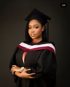 a woman wearing a graduation gown and holding her hand on her hip