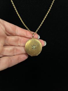 This lovely gold-filled European seed-pearl-centered starburst locket will speak volumes with its elegant simplicity. It features an engraved star with blue-stone-studded delicate rays and an interesting engraved pattern along its perimeter. This gem of a locket hangs on a cool vintage textured gold-filled chain. Hinges open from the top. Vintage Star-shaped Wedding Jewelry, Brass Star-shaped Jewelry Gift, Yellow Gold Brass Jewelry With Star Charm, Celestial Pendant Locket Jewelry, Gold Pendant Locket Necklace With Birthstone, Elegant Star-shaped Brass Jewelry, Gold Engraved Star Of David Necklace, Engraved Star-shaped Yellow Gold Necklace, Antique Gold Star-shaped Jewelry