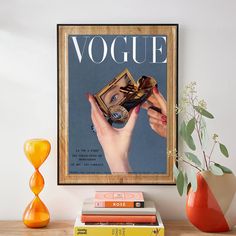 a magazine cover with a woman's hand holding an object in front of it