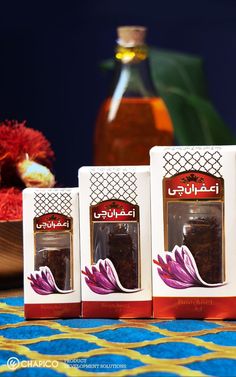 three packages of tea sitting on top of a table