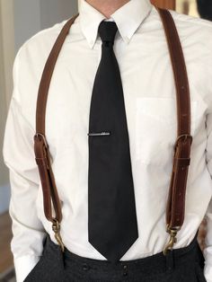 "These Durable Snap Suspenders were precisely crafted to match those heavy duty suspenders made in 1900's in the New and Old World. If you are looking for Leather Snap Suspenders that will last decades (perhaps even a century then you have found the right ones! We carefully chose the kind of leather for this project, because we want to give you a handmade product with the greatest quality of all. We have been crafting hundreds of these unique handmade leather suspenders for weddings all over the Fitted Suspenders For Groom Suit And Tie Accessories, Adjustable Classic Belts And Suspenders For Groom, Dapper Formal Belts And Suspenders With Ties, Classic Formal Suspenders For Suit And Tie, Classic Fitted Suit And Tie Accessories With Suspenders, Classic Business Belts And Suspenders With Belt Clip, Classic Suspenders For Black Tie Events, Classic Business Belt With Belt Clip, Classic Formal Belts And Suspenders With Ties