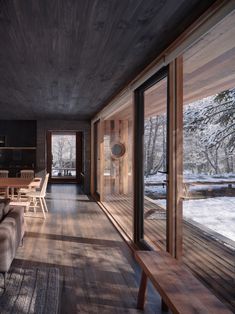 a living room filled with furniture next to a wooden floor covered in lots of windows