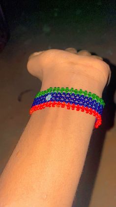 a person's arm with a colorful bracelet on it