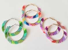 Beaded earrings Hoop earrings of 5 cm internal diameter, external diameter approximately 7.7 cm Multicolored hoop earrings, boho style Shipping with tracking for France, IF YOU WANT TRACKING ABROAD, choose the "economic" option when paying. Earrings handcrafted by me. A little "trick" to keep your hoop earrings more rigid if you wish; Apply a coat of clear nail polish to the beads, this will help prevent them from curling. Do not hesitate to contact me so that I can make these hoop earrings in t Earrings Bead, Pearl Beading, Clear Nail, Seed Beading, Clear Nail Polish, Earrings Hoop, Bracelets Handmade Beaded, Beaded Hoop Earrings, Beaded Hoops