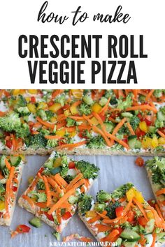 a pizza with cheese, broccoli and carrots on it is cut into squares