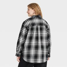 This Oversized Flannel Long-Sleeve Collared Button-Down Shirt from Universal Thread™ makes a versatile addition to your wardrobe. Made from midweight cotton, this collared shirt features a front button placket, long sleeves with buttoned cuffs, a patch pocket on the chest and a box-pleat back yoke for classic touches. The oversized fit and shirttail hemline complete the design, allowing you to wear it tucked in, untucked, layered open and unbuttoned, or with rolled-up sleeves. Universal Thread™: Oversized Plaid Tops For Work, Oversized Casual Flannel Shirt For Workwear, Oversized Black Flannel Shirt For Winter, Oversized Flannel Shirt For Winter, Oversized Button-up Winter Shirt, Oversized Casual Flannel Shirt With Buttons, Oversized Button-up Shirt For Fall, Winter Oversized Button-up Shirt, Oversized Black Flannel Shirt For Fall