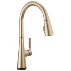 an image of a kitchen faucet with the pull out sprayer in brushed brass