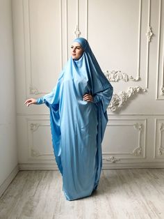 Tender light sky blue silk long khimar with high cuffs. This jilbab will be a good cover for you. Delicate fine silk ideal for summer weather. Always keep in mind that the fabric is enlightened, at the bottom have to be the dress. An elegant way for the believing women. Buttons secure the cuffs. Be sure when ordering in the note write the length of the khimar and the girth of the wrist.We can sew khimar in any other color! This handy headdress like those who do not yet know how to wind a scarf, Blue Long Sleeve Agbada For Wedding, Modest Blue Niqab For Eid, Blue Modest Khimar For Eid, Blue Long Sleeve Agbada For Eid, Long Blue Khimar For Eid, Blue Long Khimar For Eid, Blue Long Sleeve Modest Khimar, Modest Wedding Niqab For Eid, Modest Long Sleeve Blue Kaftan