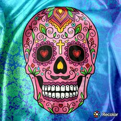 a brightly colored sugar skull on a green background