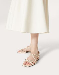 Valentino Garavani Rockstud sandal with straps in calfskin leather - Platinum-finish studs - Adjustable ankle fastening - Heel height: 5 mm / 0.2 in. - Made in Italy Sandals With Straps, Light Ivory, Strap Sandals, Valentino Garavani, Online Boutique, Calf Skin, Top Brands, Heel Height, Platinum