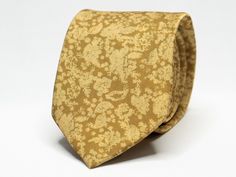 A radiant accessory that effortlessly combines sophistication with a touch of nature's beauty, this yellow floral tie is a captivating choice for those seeking a dash of vibrancy in their ensemble! Size: 7cm wide (2.75in) Color: Yellow Pattern: Floral These neckties are dry clean only. Our shop has a huge selection of ties, pocket squares, cufflinks and other suit accessories. For more of our suit accessories, please visit our shop: https://www.etsy.com/ca/shop/GentlemensEra If you have any questions or concerns, please contact us and we will be able to assist you. Instagram: https://www.instagram.com/the.gentlemens.era If you need your order on a certain date, please message before ordering to ensure your order arrives on time. Classic Yellow Wedding Tie, Adjustable Ties Neckwear For Wedding, Adjustable Wedding Neckwear Ties, Groomsmen Tie, Floral Necktie, Groomsmen Ties, Flower Tie, Wedding Tie, Yellow Tie