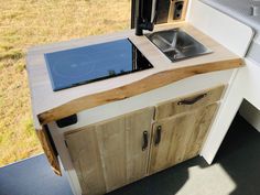 a stove top oven sitting on top of a wooden counter