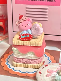 there is a small toy cake on the table