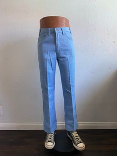 "70's Levi's Sta-Prest sky blue boot cut pants tag size 32x29. Zip fly, 50% cotton 50% polyester, good used condition, check pictures, made in U.S.A.  Please, check carefully the measurements, photos and description of the article before buying it, we do not accept changes or returns. Measurements lying face down: (mannequin is 47\" tall from the floor to the top) 16\" Waist flat face down. 40\" Outseam. 20\" Hip. 12\" Thigh. 12\" Front rise. 29\" Inseam. 9\" Leg opening. Let me know if you have any questions or would like to see additional photos. International buyers: Please ask for the shipping rates speciality for your country." Boot Cut Pants, Flat Face, Blue Boots, Face Down, Pants Men, High Grade, Boot Cut, Sky Blue, Blue Sky