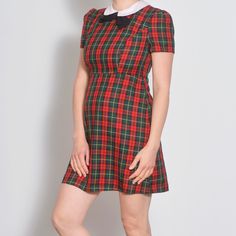 This plaid preppy dress features a charming Peter Pan collar and is handmade from tartan fabric. With a fitted skater style and short sleeves, it's a cute punk choice for size US 6. Detail: * Fabric: Cotton * Condition: very good vintage,  * Circa: 1990s * Handmade * Care Label missing Fit: * Best fit Small US 6 * * Please refer to measurements below for a proper fit * MEASUREMENTS: The sizes in the listing titles are estimates, please make sure to compare the measurements with a piece you own, to make sure the item will fit. Taken from seam to seam while the garment is lying flat. Double the armpit, waist, hips and bottom. Length - 23.0" - 58.5cm Shoulder to shoulder - 13.75" - 35cm Sleeve - 7.25" - 19cm Armpit - 17.5" - 44.5cm Waist - 14.75" - 38cm Hips - 19.25" - 49cm Bottom - 22.25" - Preppy Dress, Punk Dress, Preppy Dresses, Tartan Fabric, Skater Style, Care Label, Pan Collar, Black Bow, Peter Pan Collar