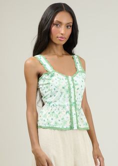 Whether you're headed to your tea party or out and about around town, this top is a fun way to add some subtle color to your outfit. Sleeveless, embroidered and sweetheart neckline combine perfectly. The top has a snatched fit with button up in the front and ending with an enchanting flair. Wear it with shorts, denim, or flowy pants.- Embroidered- Button up- Lining- SleevelessSize + Fit - Model is 5'8" and wearing size XS- Measurements taken from size S - Chest: 17 1/2"- Length: 12 5/8" Flowy Pants, Shorts Denim, Button Up Top, Striped Crop Top, Clothing Essentials, Summer Fashion Outfits, Out And About, Spring Dress, Sweater Accessories