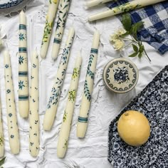 some candles are laying out on a table