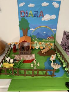 there is a cake made to look like a farm scene with animals on the fence