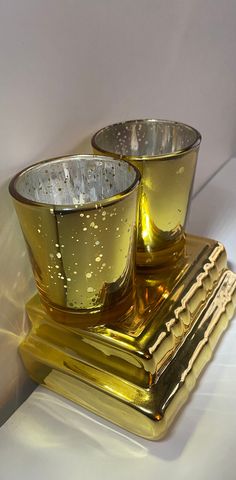 two glass cups sitting on top of each other