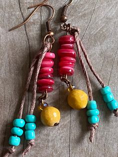 "These beautiful dangle earrings are made with copper ear wires, turquoise blue seed beads on a hemp tassel, red shell beads, amber faceted glass & faceted golden marble beads. The small amber faceted czech glass beads really sparkle! I tried to photograph them at different angles so that you could see how they capture the light. From the top of the ear wire to the bottom measures 2.5\" Please take a few moments to browse through my shop. I have a large selection of unique belt buckles, leat Bohemian Jewelry Diy, Hippie Jewelry Diy, Simple Bead Earrings, Purse Tassels, Indie Earrings, Earrings 2024, Wood Beads Jewelry, Golden Marble, Bohemian Style Jewelry