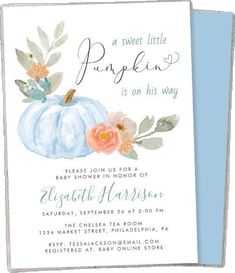 a baby shower is shown with a blue pumpkin and flowers on the bottom of it