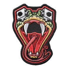 a red and black patch with an image of a snake's head on it