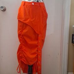 Drawstring Nylon Long Skirt,Color Orange,The Fabric Is Stretchy. High Waist Nylon Skirt For Spring, Fitted Nylon Bottoms With Drawstring, Casual Nylon Skirt For Spring, Long Skirts Orange, Spring Nylon Tie-side Bottoms, Orange Long Skirt For Festival, Orange Long Skirt, Casual Orange Nylon Bag, Orange Long Sleeve Nylon Windbreaker