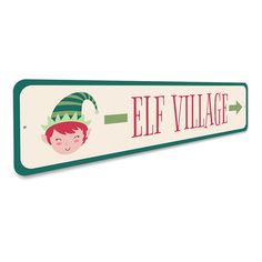 a wooden sign that says elf village with an elf's head on the front