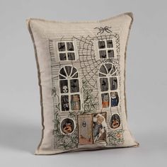 a pillow with an image of a house on it