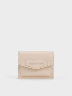 It is possible to stand out with a simple card holder. This piece features a classic rectangular silhouette with a front flap and snap button closure, complemented by an eye-catching oat-white finish. It also includes a unique mini top handle, allowing it to double as a micro bag, and a detachable strap that will come in handy on days when you are travelling light. Micro Bag, Envelope Card, Mini Top, Charles Keith, Travel Light, Simple Cards, Card Wallet, Snap Button, Oats